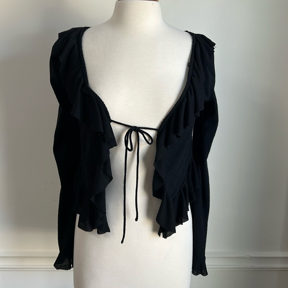 Free People ruffled sweater. Size M Black. No tags but never worn